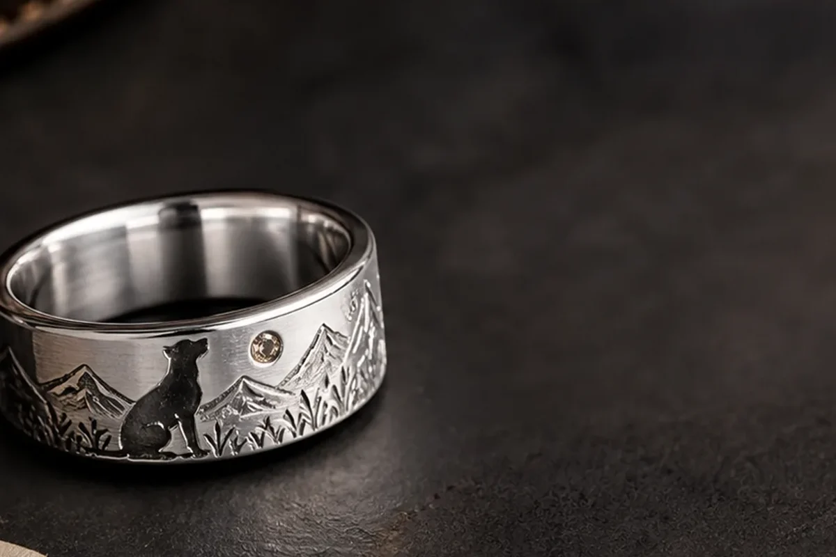 Dog memory ring with a silver band, collar tag, photo card, and one remembered daily habit