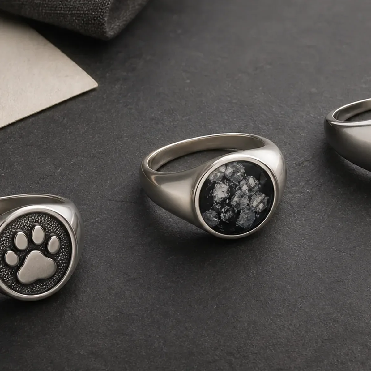 Ring with dog nose print shown with an uncluttered silver band and one focused memorial detail